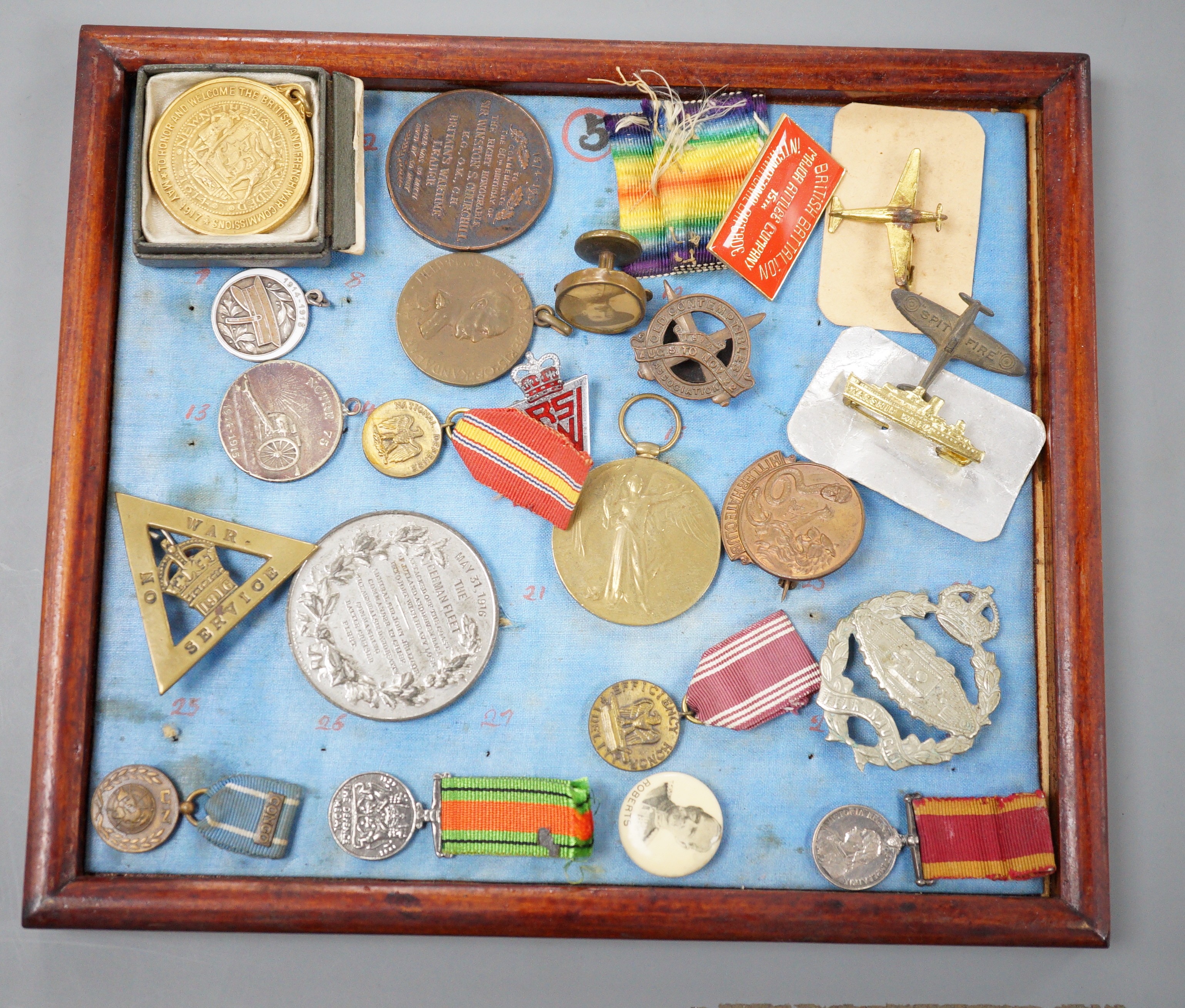 A group of WWI and WW2 and other military medals, badges and ephemera